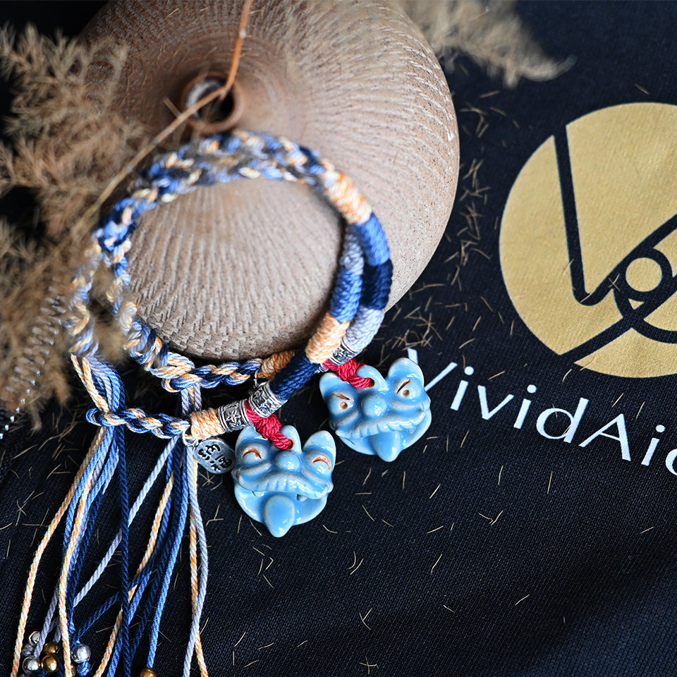 Azure Wave handcrafted Tile Cat bracelet by VividAion, featuring blue-toned ceramic WaMao charm and artisan cord, inspired by mythic guardians.