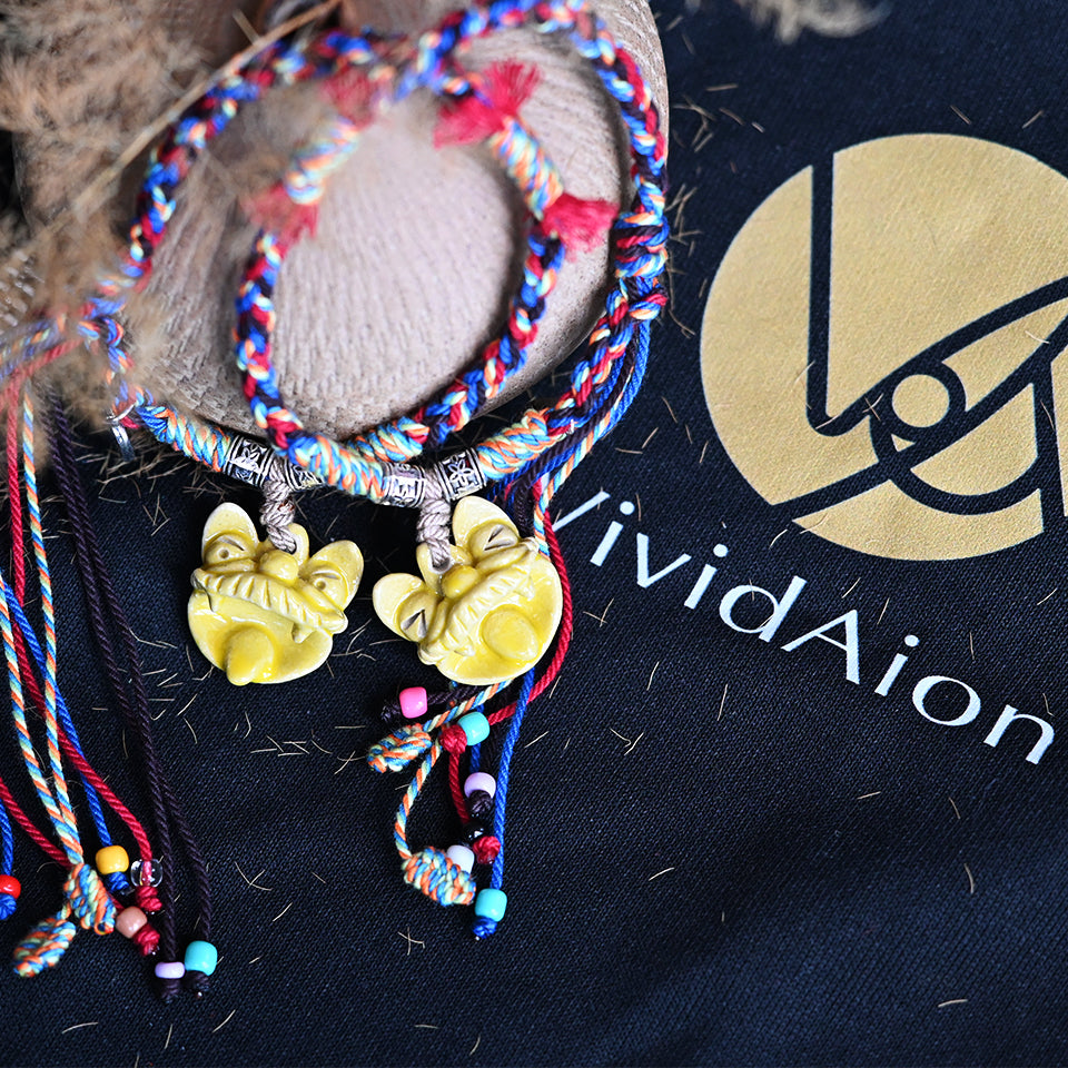 Golden Dawn handcrafted ceramic WaMao bracelet by VividAion, combining golden glaze tones with traditional guardian symbolism.