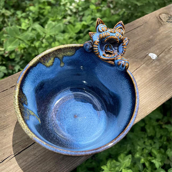 Azure blue WaMao cat-shaped ceramic cup by VividAion, merging whimsy and protection in handcrafted artistry.