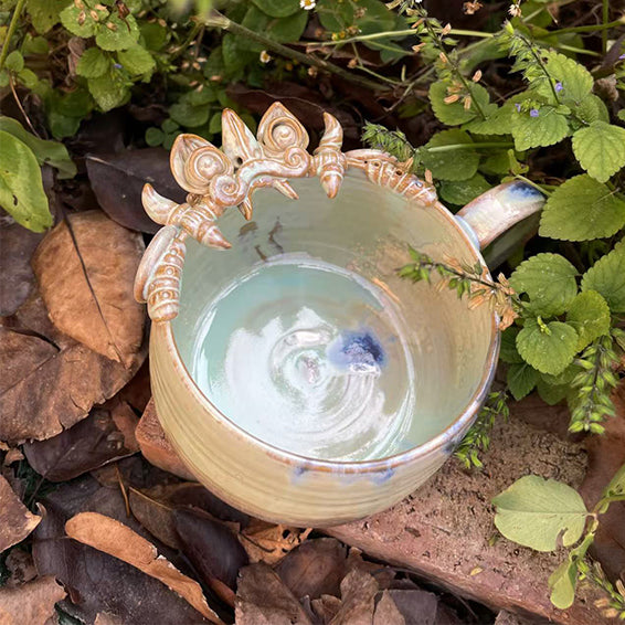 White handcrafted ceramic WaMao mug by VividAion, minimalist yet symbolic of peace and purity.