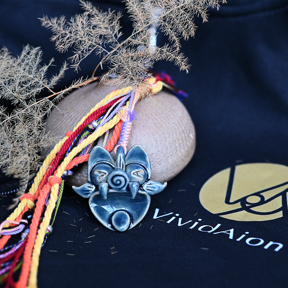 Azure Wave ceramic WaMao guardian ornament in deep blue tones, handmade by VividAion, representing calm and protective energy.