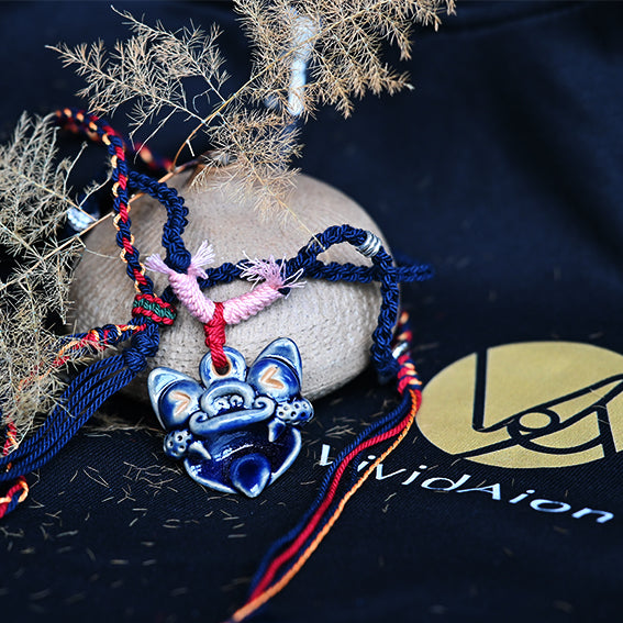 Azure Wave handcrafted WaMao necklace from VividAion, featuring a blue ceramic guardian charm inspired by Yunnan Tile Cat mythology.