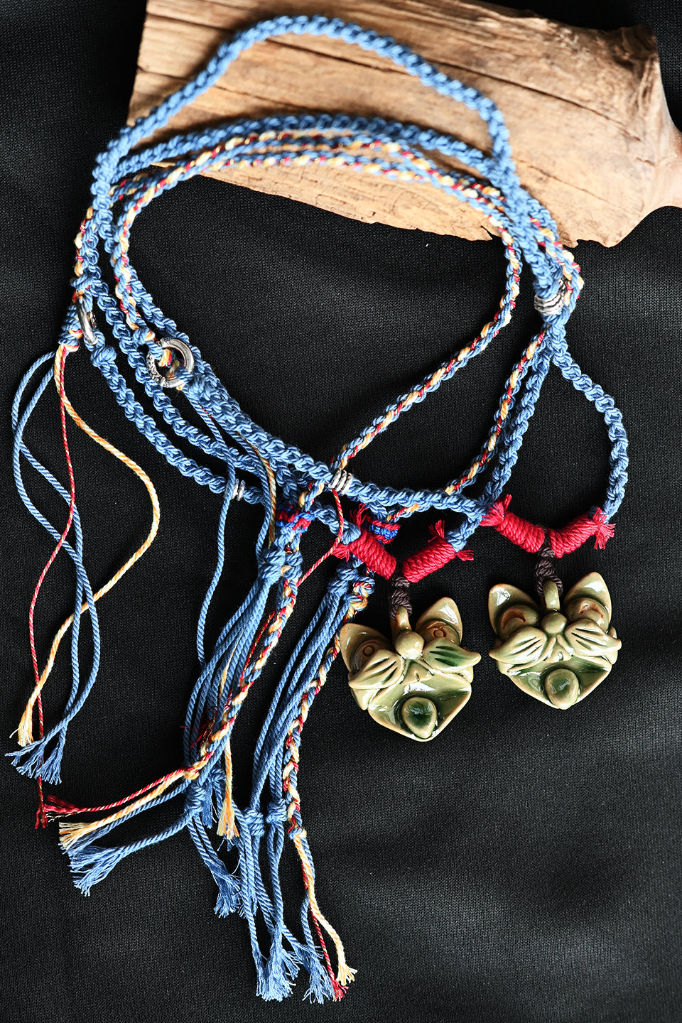 Verdant Wood handcrafted WaMao ceramic necklace by VividAion, combining natural glaze with protective guardian symbolism.