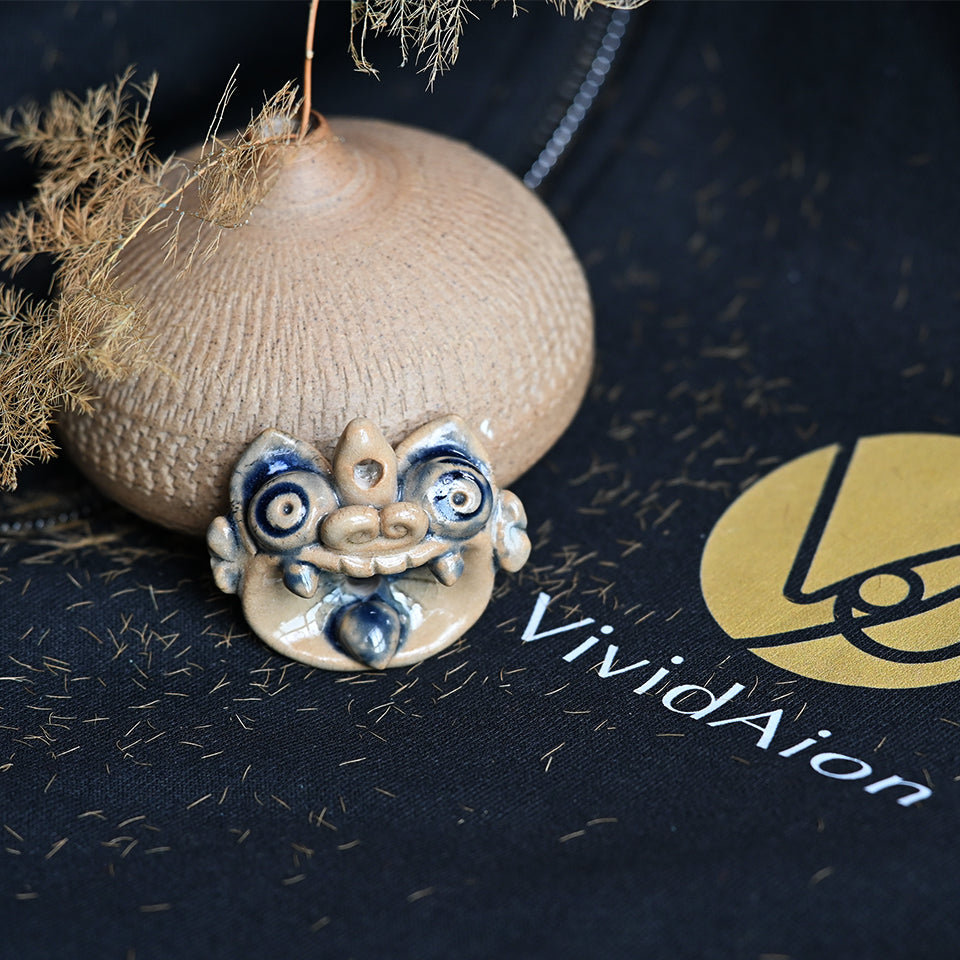 Heart of Earth ceramic pendant in khaki glaze by VividAion, symbolizing grounding energy and natural beauty of handcrafted Tile Cat design.