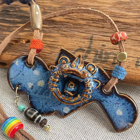 Azure WaMao pendant necklace (Style A) by VividAion Liang Yu, handcrafted ceramic amulet symbolizing harmony and guardian blessing.