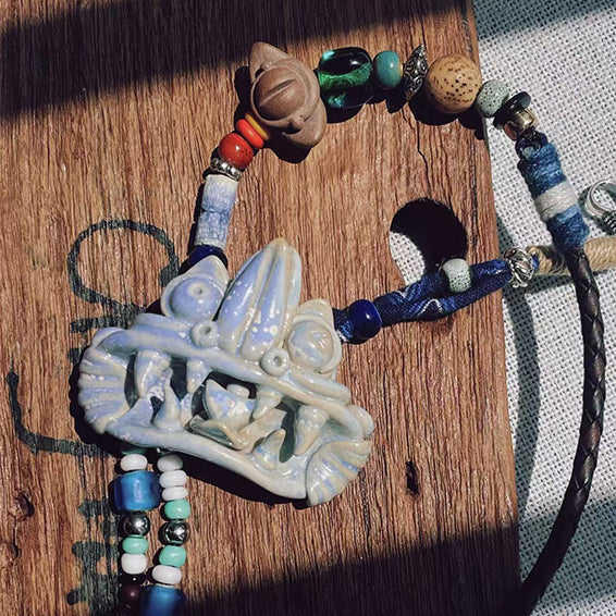 VividAion Liang Yu handcrafted 'Glacier Blue' WaMao pendant necklace, cool-toned ceramic guardian symbol of serenity and creativity.