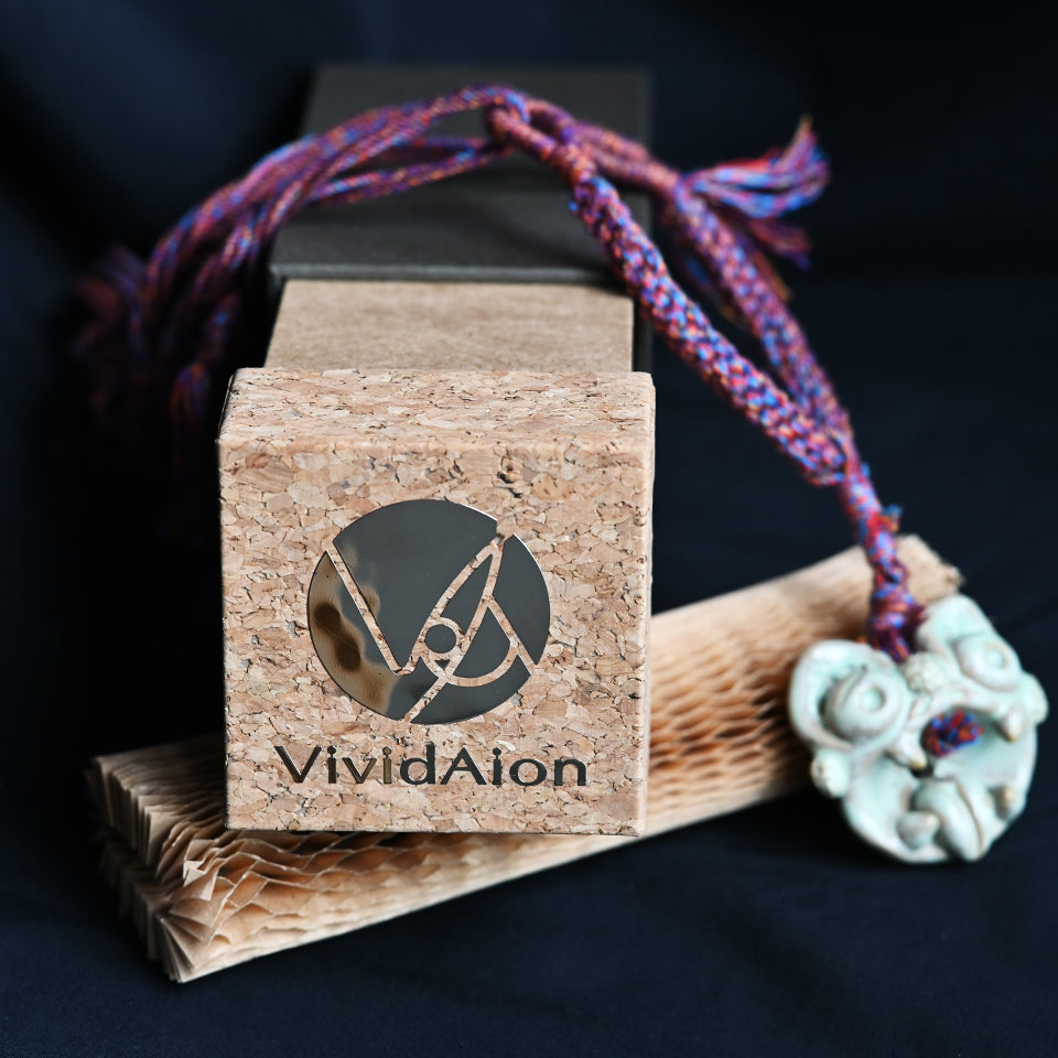 Handcrafted WaMao ceramic pendant necklace presented in VividAion signature eco gift box, symbol of protection and artistry.